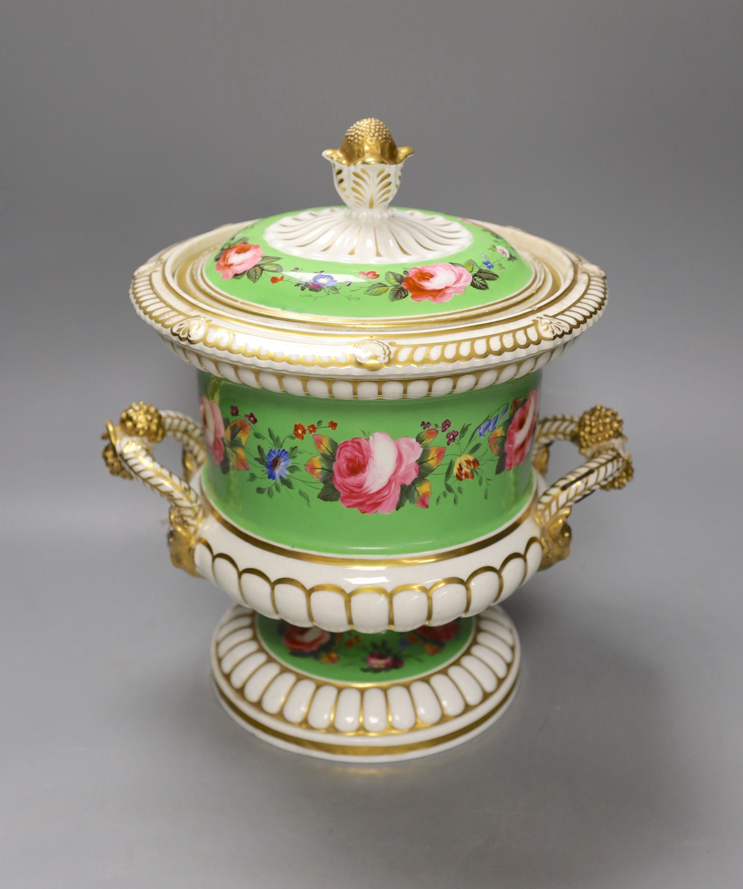 An English porcelain campana shaped ice pail and two covers painted with flowers and a green ground, c.1830 (handles re-attached) 30cm